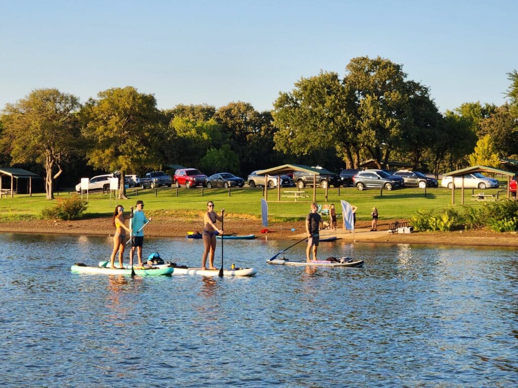 Group paddling on SUP boards at Full Moon Paddle