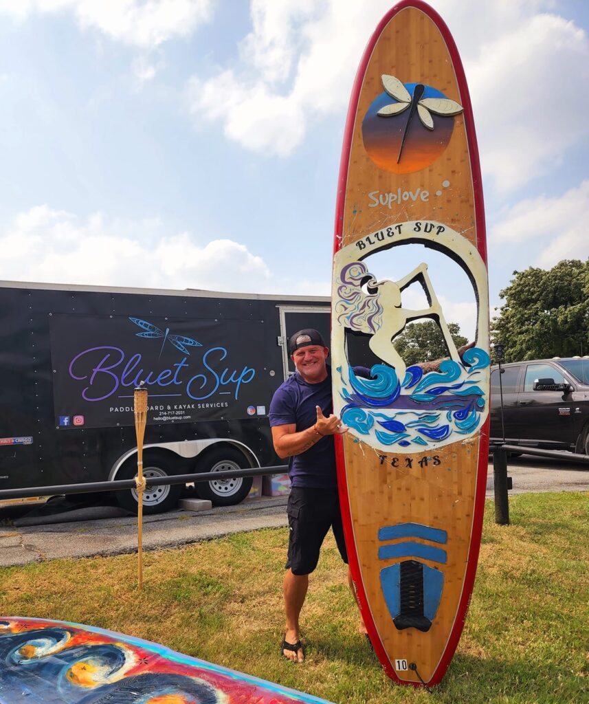 Bluet Sup logo on custom paddleboard at Pilot Knoll Park