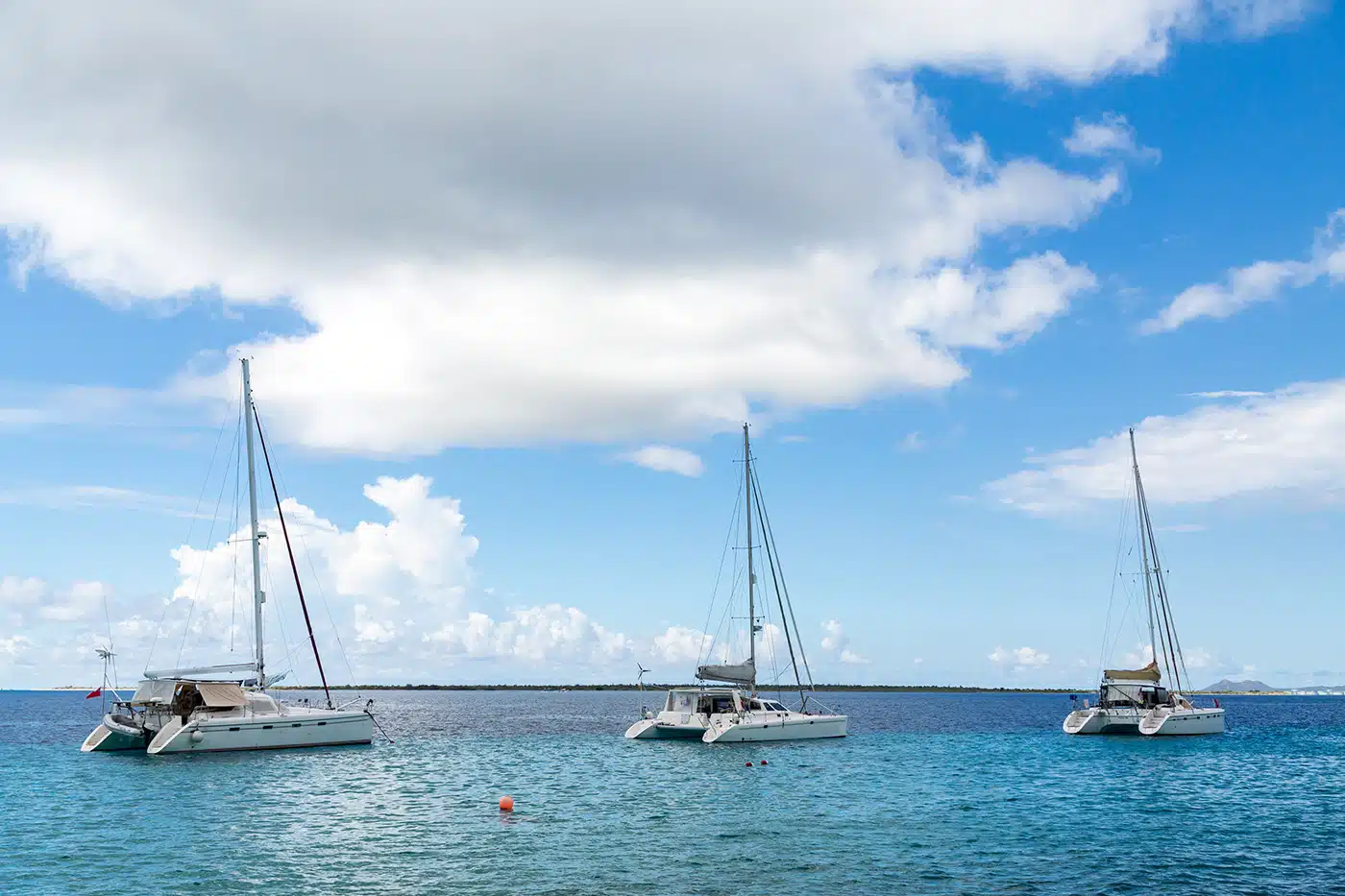 three white catamaran's in Belize